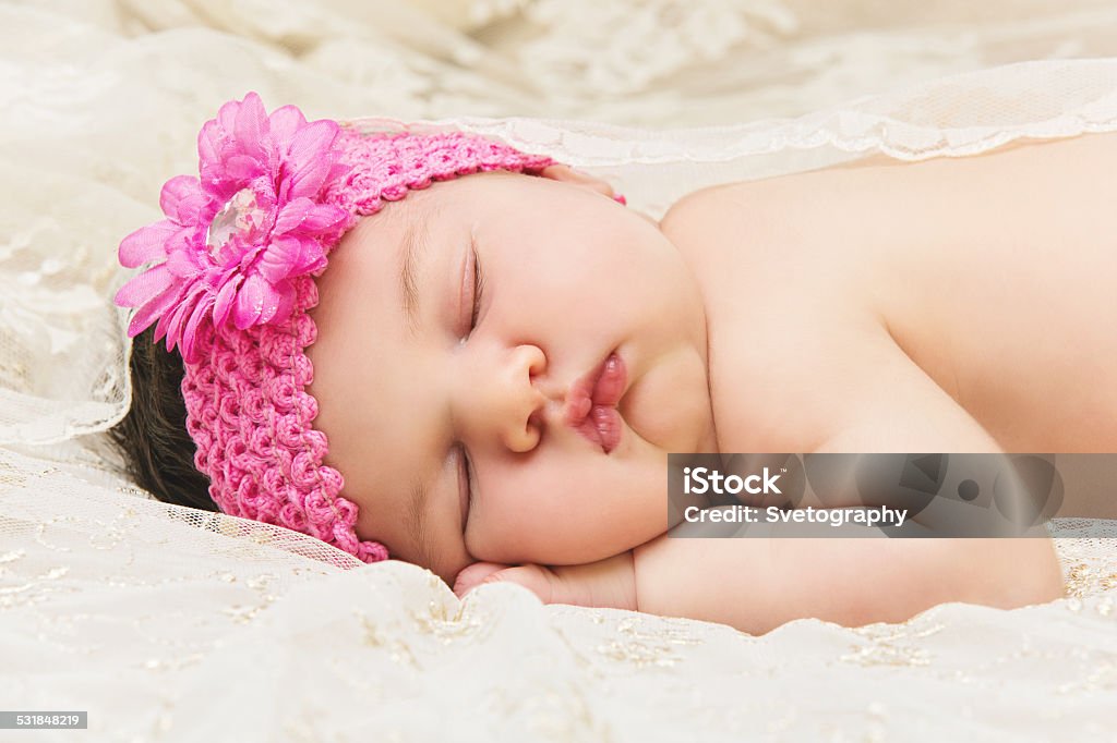 Baby sleeping on stomach Adorable baby sleeping on stomach 2015 Stock Photo