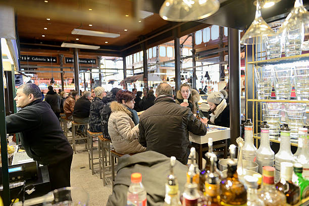 Madrid, Spain - February 19, 2016: People eat and drink at Mercado San Miguel. Mercado San Miguel is an historic, monumental market and most visited place in Madrid.