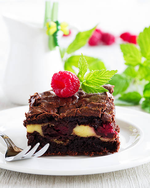 istock Chocolate brownie with raspberries and mascarpone. 531848573