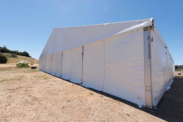 istock Large white tent for entertaining in field 531848696