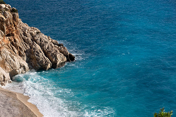 strand und tropischen meer - long exposure rock cloud sky stock-fotos und bilder