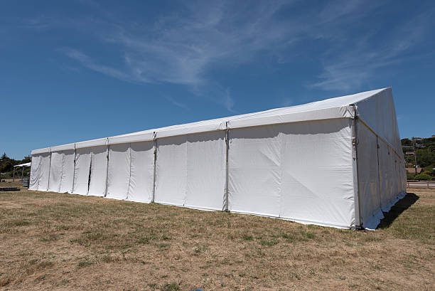 istock Large white tent for entertaining in field 531849114