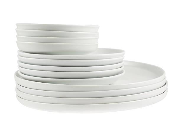istock Pile of clean white dish plates isolated 531850534