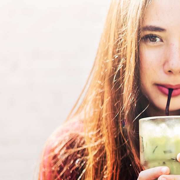 Young Woman Drinking Cold Tea Concept