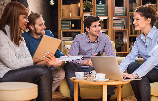 istock Group of smiling business people communicating on coffee break. 531856360