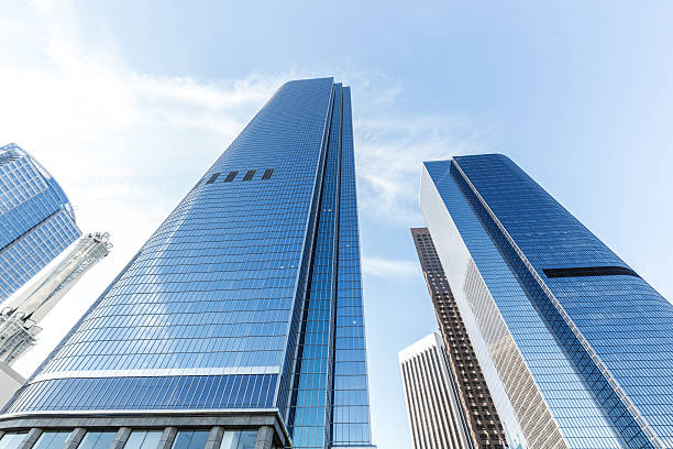 istock look up modern office building in cloud sky 531856966