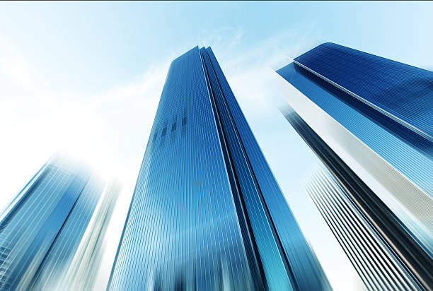 istock look up modern office building in cloud sky 531857024