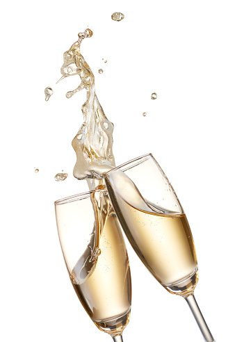 two glasses of champagne toasting creating splash