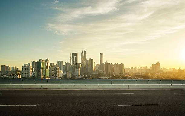 istock empty asphalt road and cityscape skyline,sunset scene 531858718
