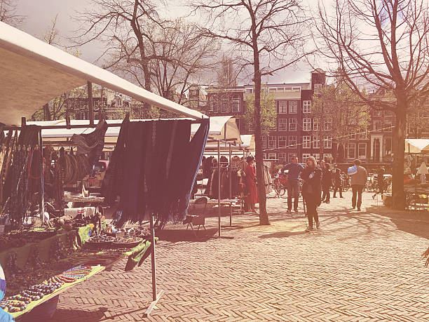 Amsterdam, Netherlands - April 16, 2016: The Noordermarkt is a square in the Jordaan neighborhood of Amsterdam in the Netherlands. Markets are held on the square every Monday. The square is lined by cafes and restaurants.
