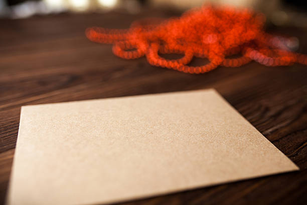 istock Envelope with Christmas decoration on wood table 531861987