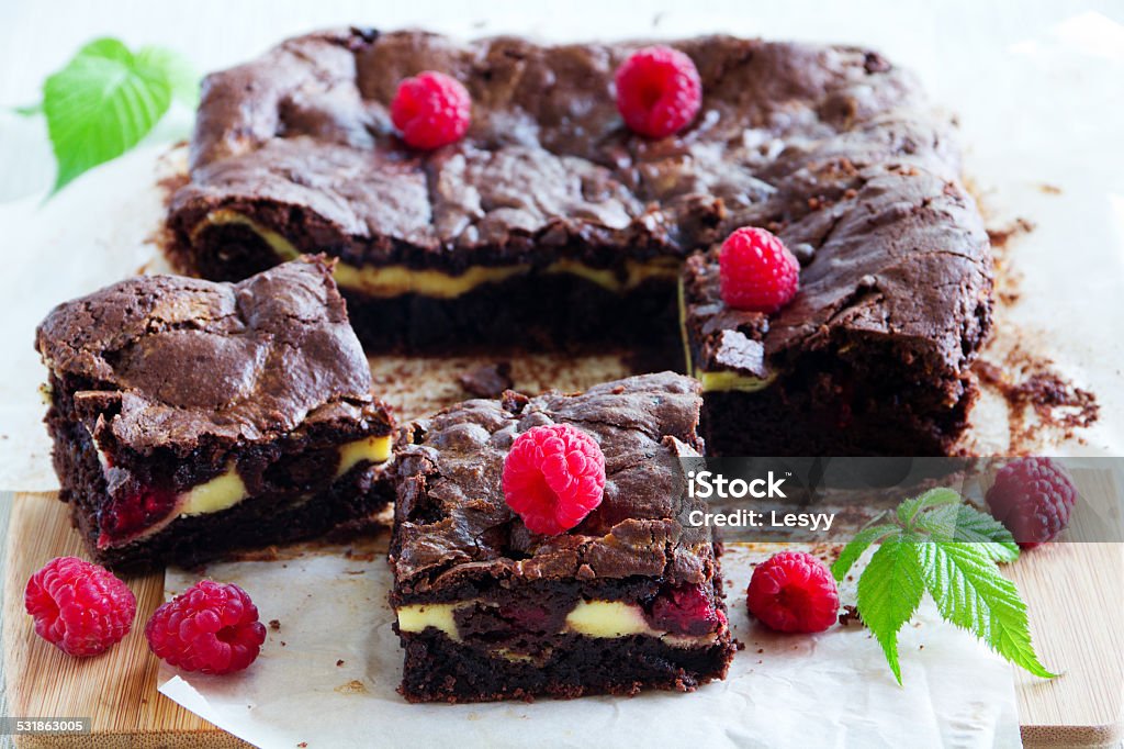 Chocolate brownie with raspberries and mascarpone. 2015 Stock Photo