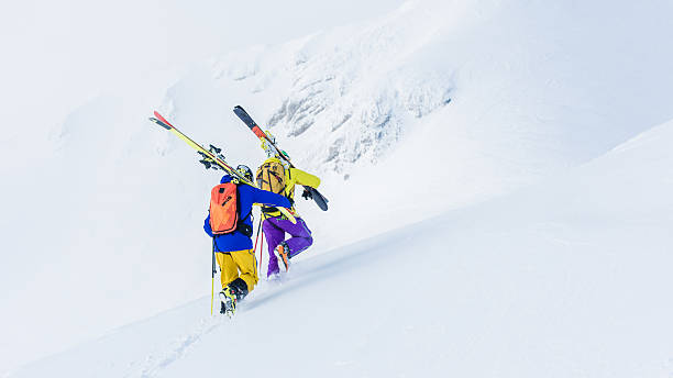 istock Skiers walking in snow 531863874