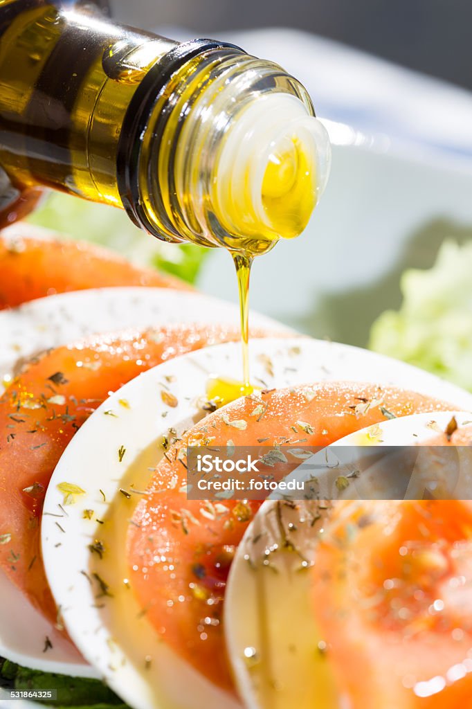 Tomato salad with cheese Delicious salad of tomato and fresh Mediterranean cheese 2015 Stock Photo