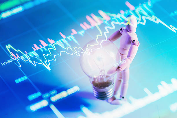 istock figurine concept holding the bulb with light 531865640