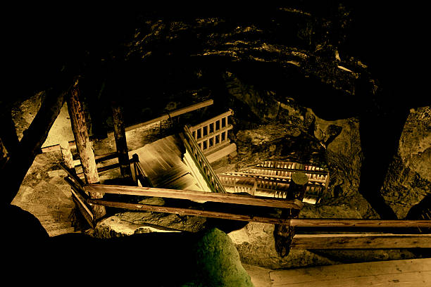 istock Gold rush. Gold mine. Stairs in cave. 531866193