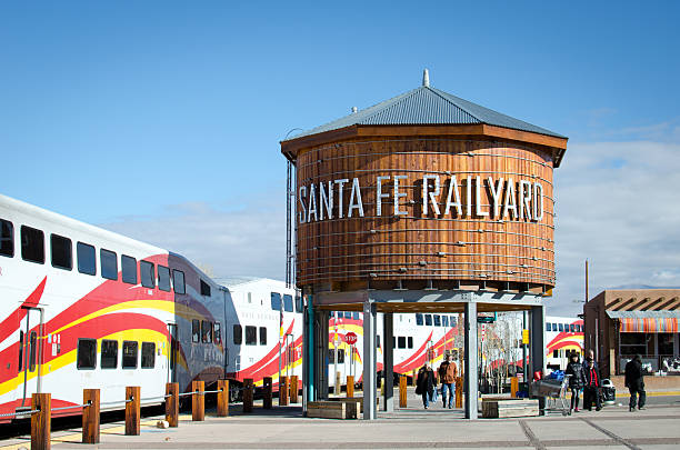 Santa Fe, NM, USA - January 10, 2015:  The Santa Fe Depot Station comes to life as passengers exit the Rail Runner commuter train.  