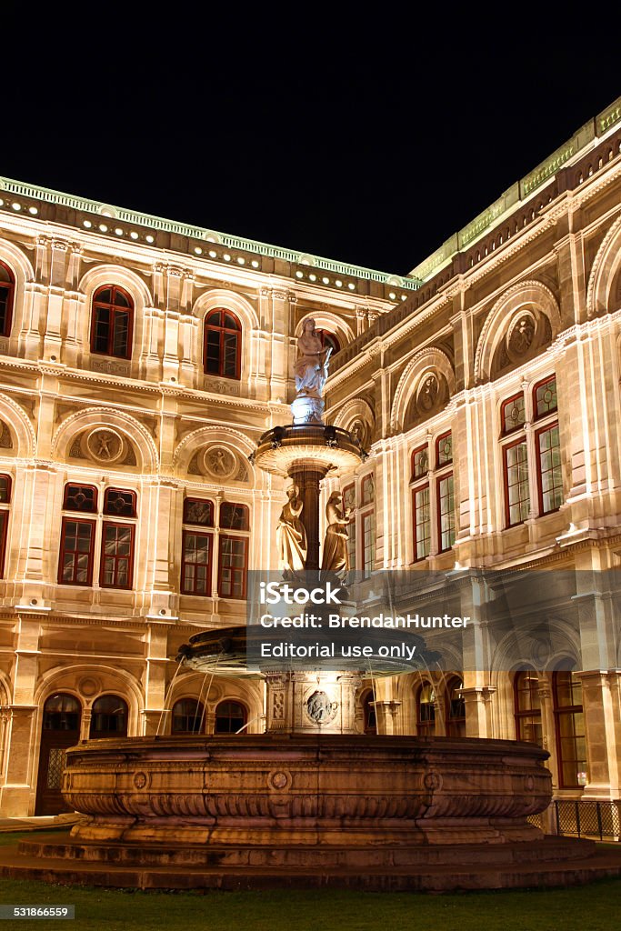 Operatic Fountain Vienna, Austria - June 12, 2014: The Vienna State Opera House in the evening. 2015 Stock Photo