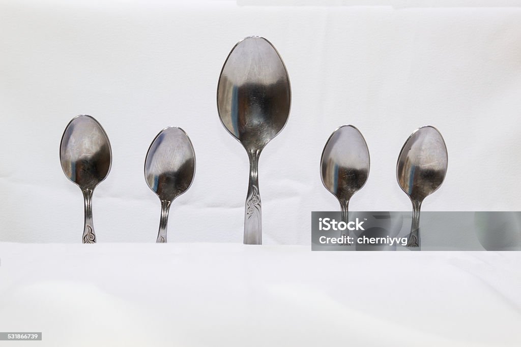 Spoons and forks on a white background Spoons and forks, small spoons on a white background 2015 Stock Photo