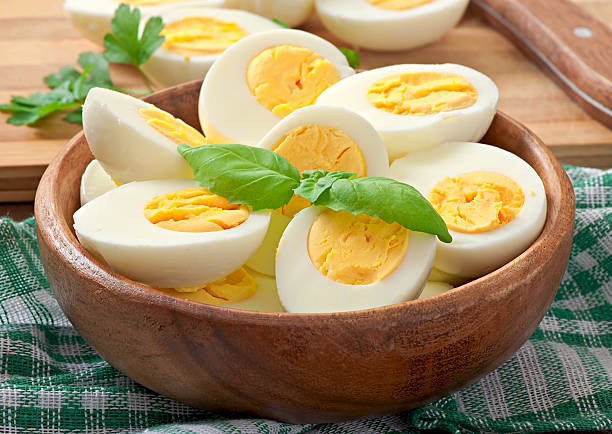 istock Boiled eggs in a bowl decorated with parsley leaves 531866993