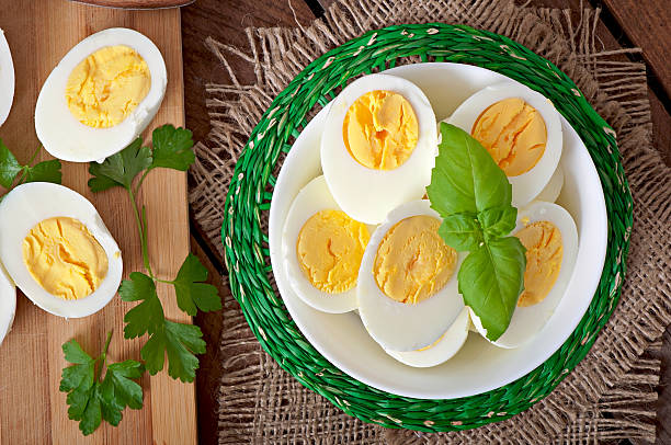 istock Boiled eggs in a bowl decorated with parsley leaves 531867513