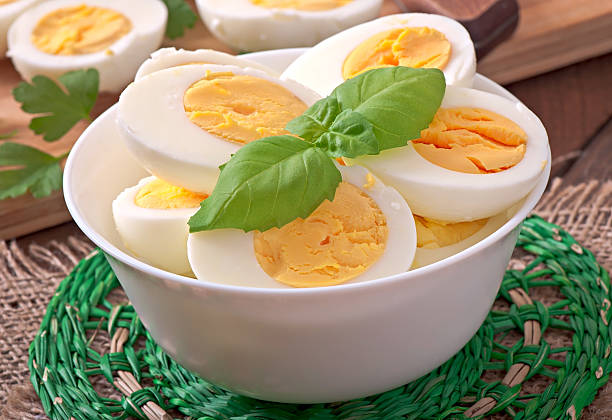 istock Boiled eggs in a bowl decorated with parsley leaves 531867527