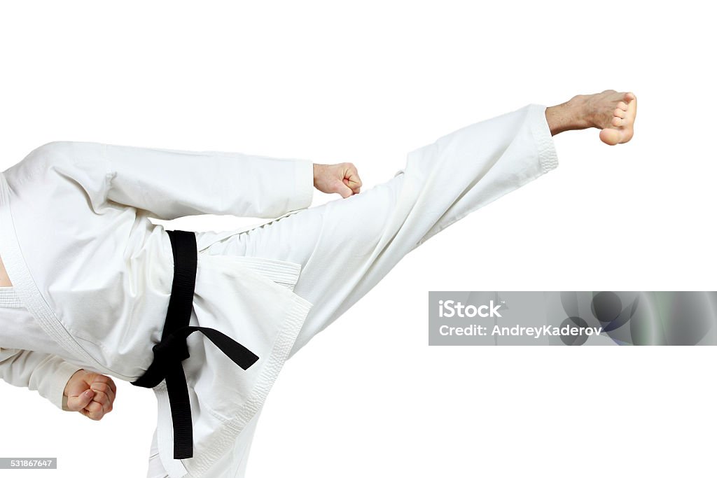 In karategi man doing kick yoko-geri Karategi Stock Photo
