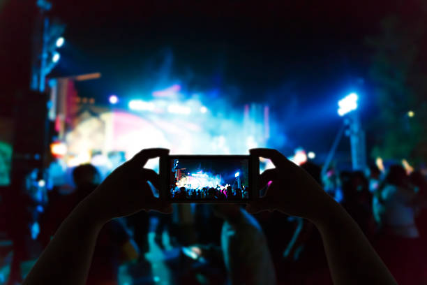 istock Take photo concert in front of stage 531868144