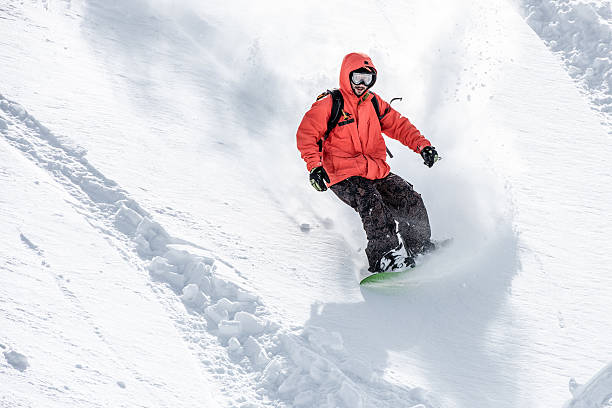 Male snowboarder in snow