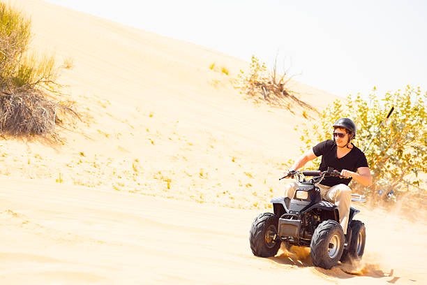 istock tourist riding quad bike 531869293