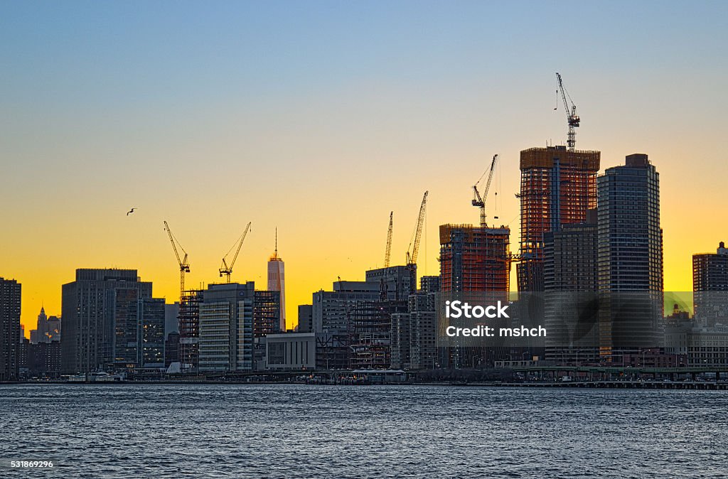 Tower cranes over a Manhattan. New beginnings in the Downtown Manhattan, New York City. New York City Stock Photo
