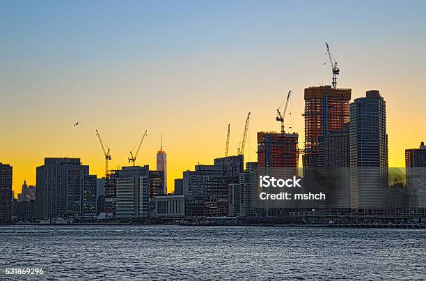 Tower Cranes Over A Manhattan Stock Photo - Download Image Now - New York City, Construction Site, Construction Industry