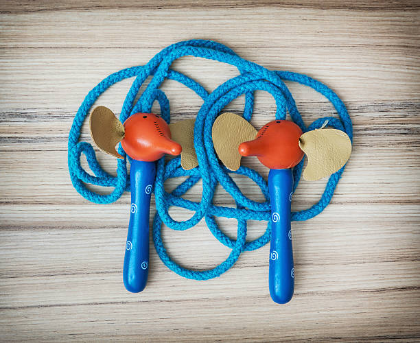 istock New skipping rope on the wooden background 531870338