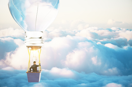 Idea concept with lightbulb airballon and businessman in blue skies. 3D Render