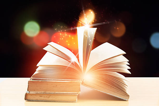 istock Abstract magic book on wooden background 531873820