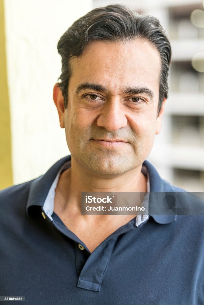 Forty something man Forty something Hispanic man posing looking at the camera 2015 Stock Photo