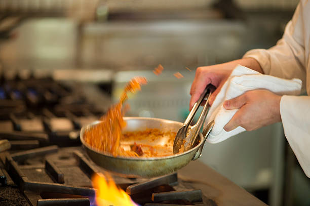 The chef making a pasta source