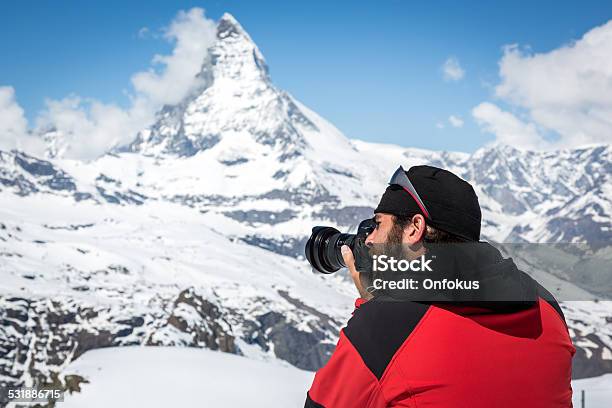 Man Photographer Taking Picture With Dslr Camera Of Matterhorn Switzerland Stock Photo - Download Image Now