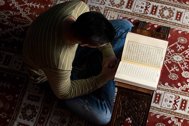 istock Muslim Man Is Reading The Koran 531887655