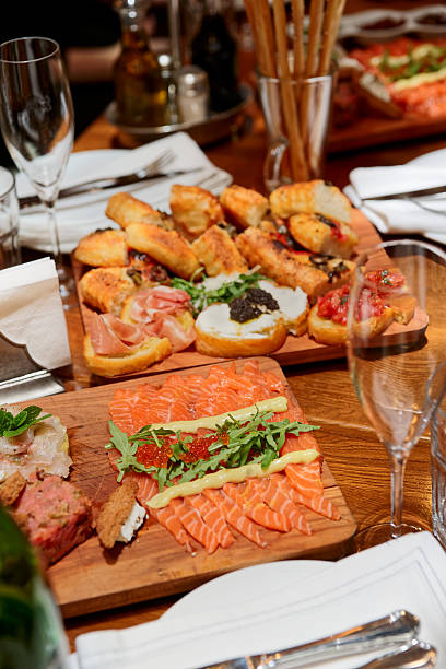 istock Italian appetizers on wooden plank 531888445