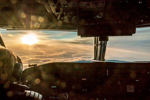 Pilot of commercial aircraft is enjoying stunning sunrise.