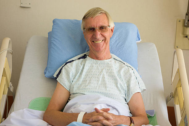 istock Mature Man Smiles From His Hospital Bed 531900629