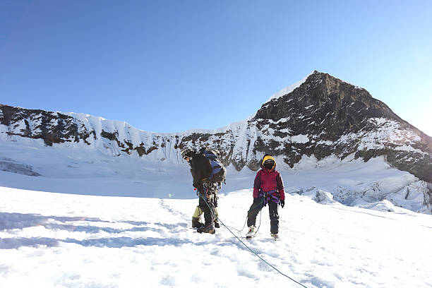 istock trekker walk to summit in team 531901445