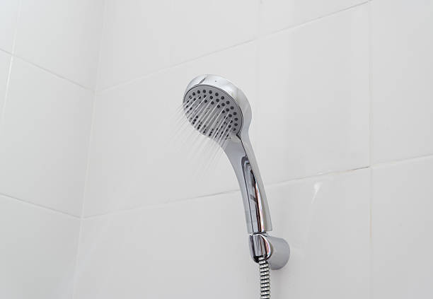 istock shower head in bathroom with water drops flowing 531901571