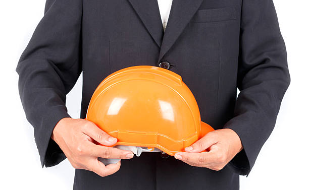istock Businessman with construction helmet. Isolated on white backgrou 531903383