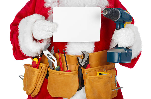 Santa Claus with a tool belt. stock photo