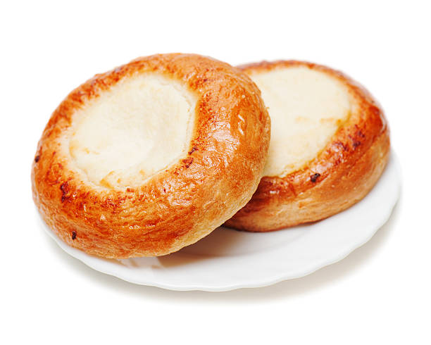 istock Fresh buns muffins with cottage cheese on white background. 531904927