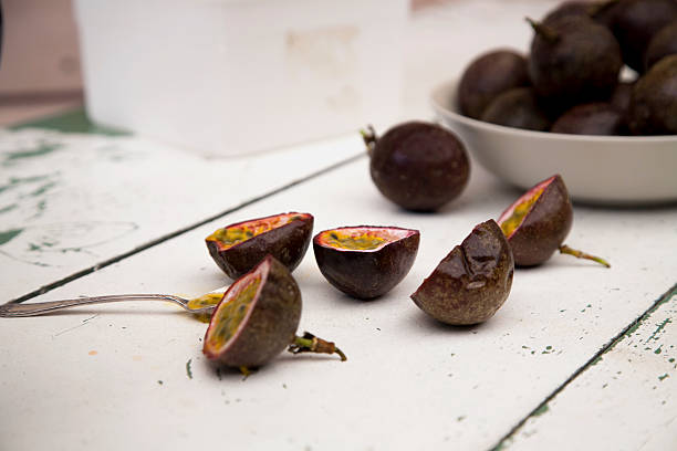 istock Passionfruit halves in a bowl and on a table 531907957