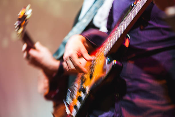 istock Colorful blurred rock music background, guitar 531912834