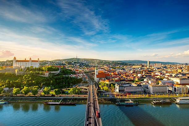 Bratislava cityscape view on the old town Bratislava aerial cityscape view on the old town with Saint Martin's cathedral, castle hill and Danube river on the sunset in Slovakia. Wide angle view with copy space bratislava photos stock pictures, royalty-free photos & images